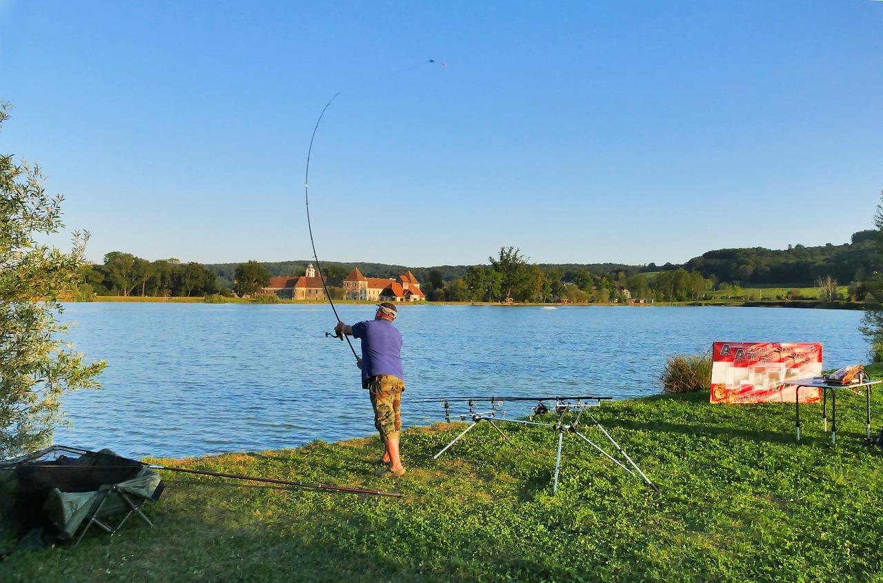 Photo of a fisherman with gear on a carp