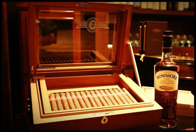 Photo of whiskey bottle and box of cigars