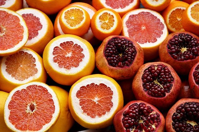 Serving pomegranate and oranges on the counter