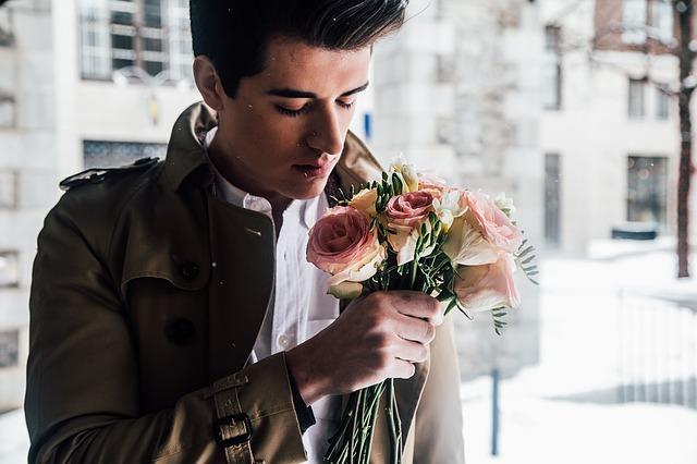 Young man with a bouquet of flowers