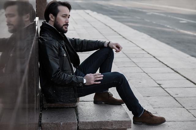 Pensive man sitting on the steps