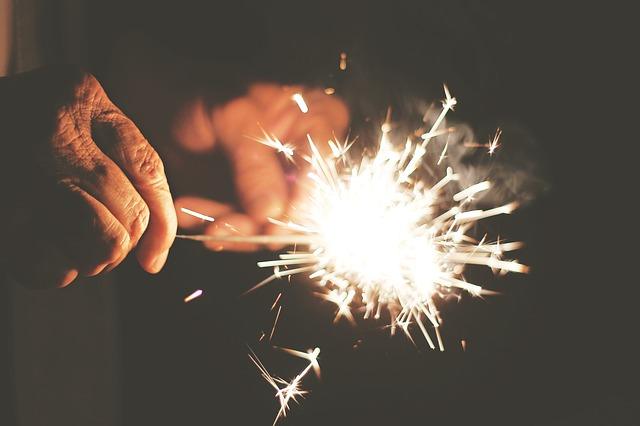 A man lights sparklers