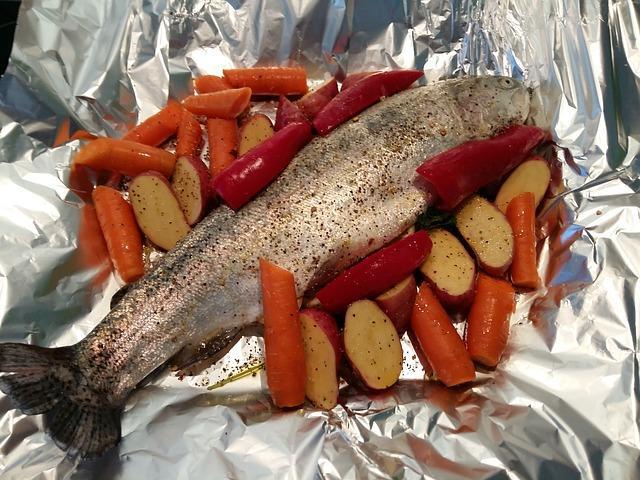 Red fish on foil before baking