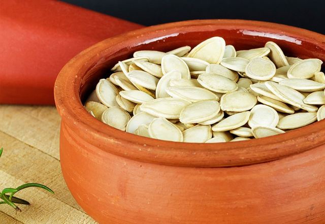 Photo of sunflower seeds in a clay bowl