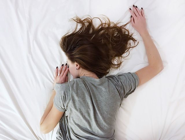 Girl sleeping on her stomach